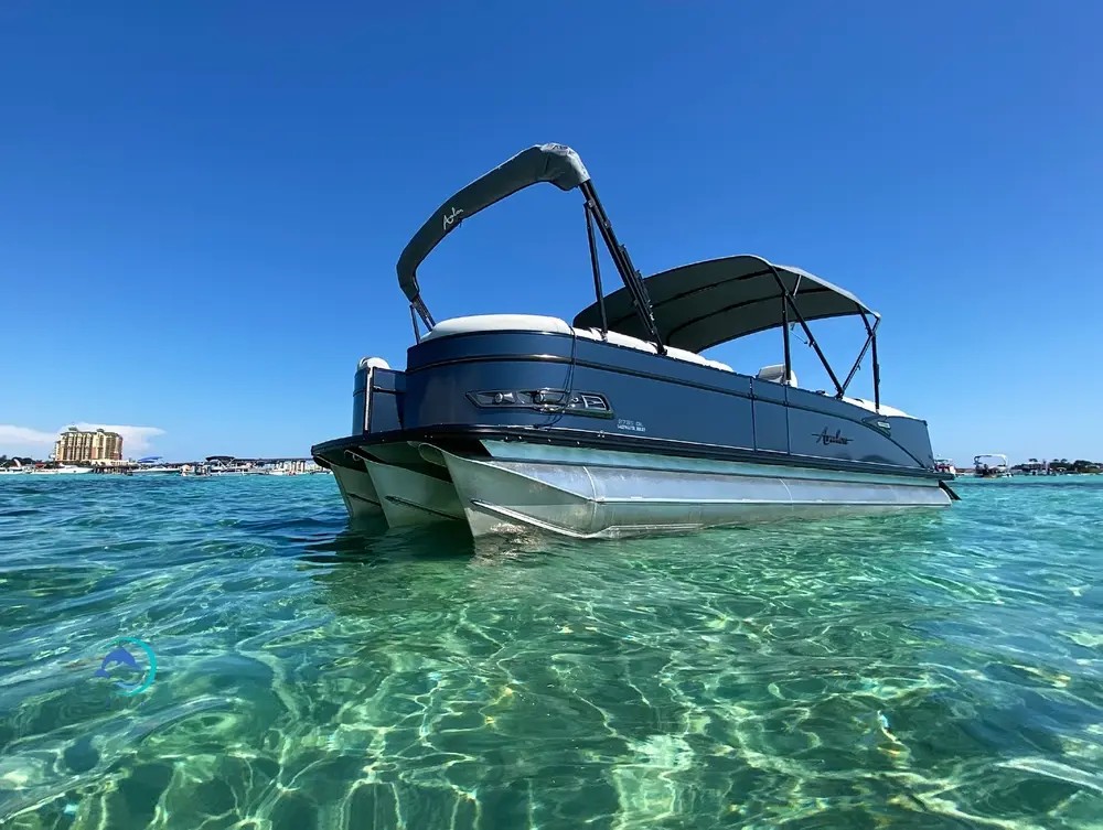 A private boat anchored in clear shallow water at Crab Island