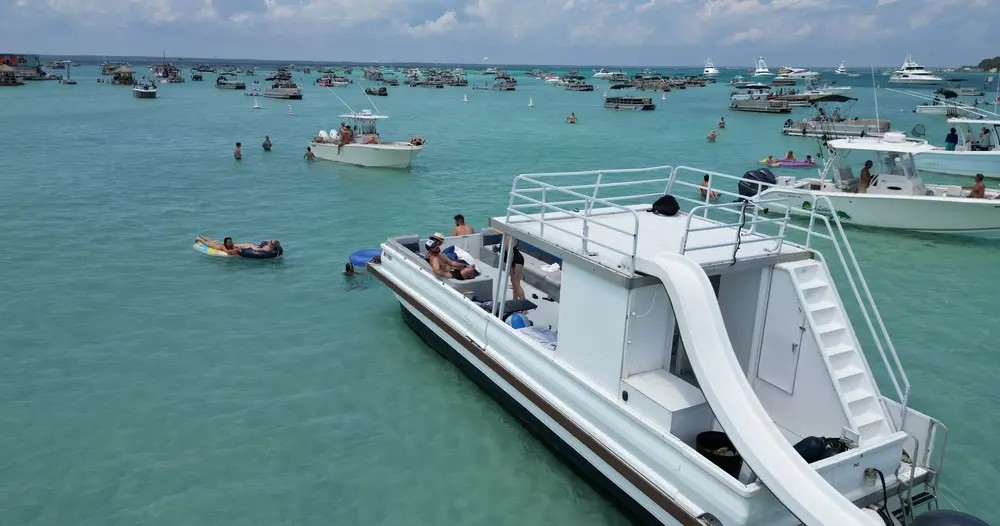 Boats gathered on the Crab Island sandbar, seen from above