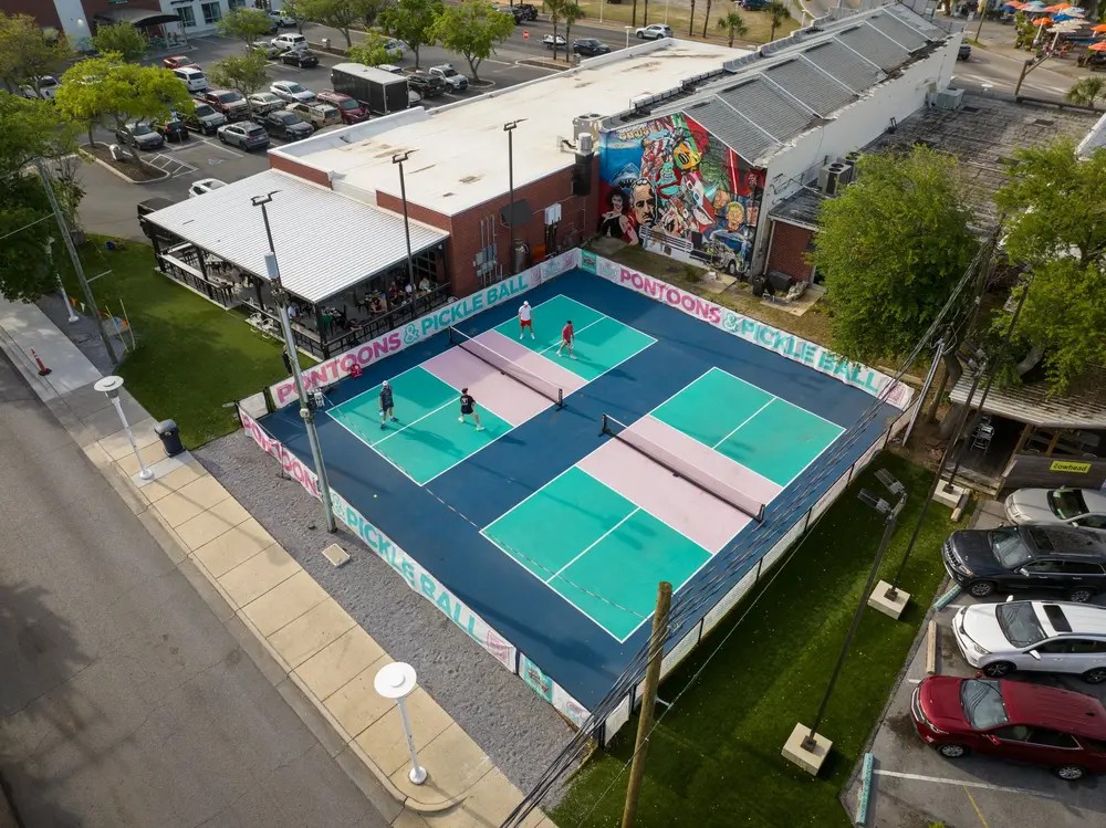 Pickleball courts by the water, seen from above