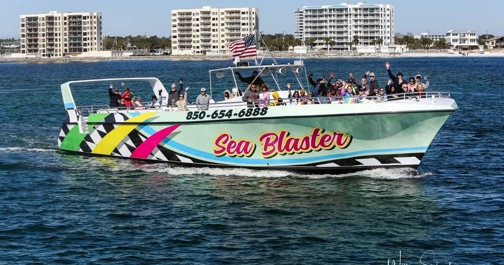 The Sea Blaster cruise boat underway, passengers on both decks